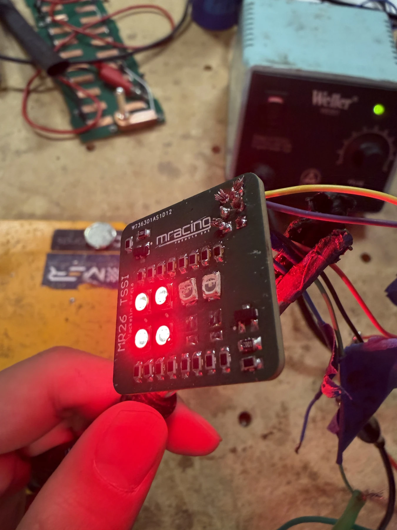 Red LEDs illuminated during bench testing.