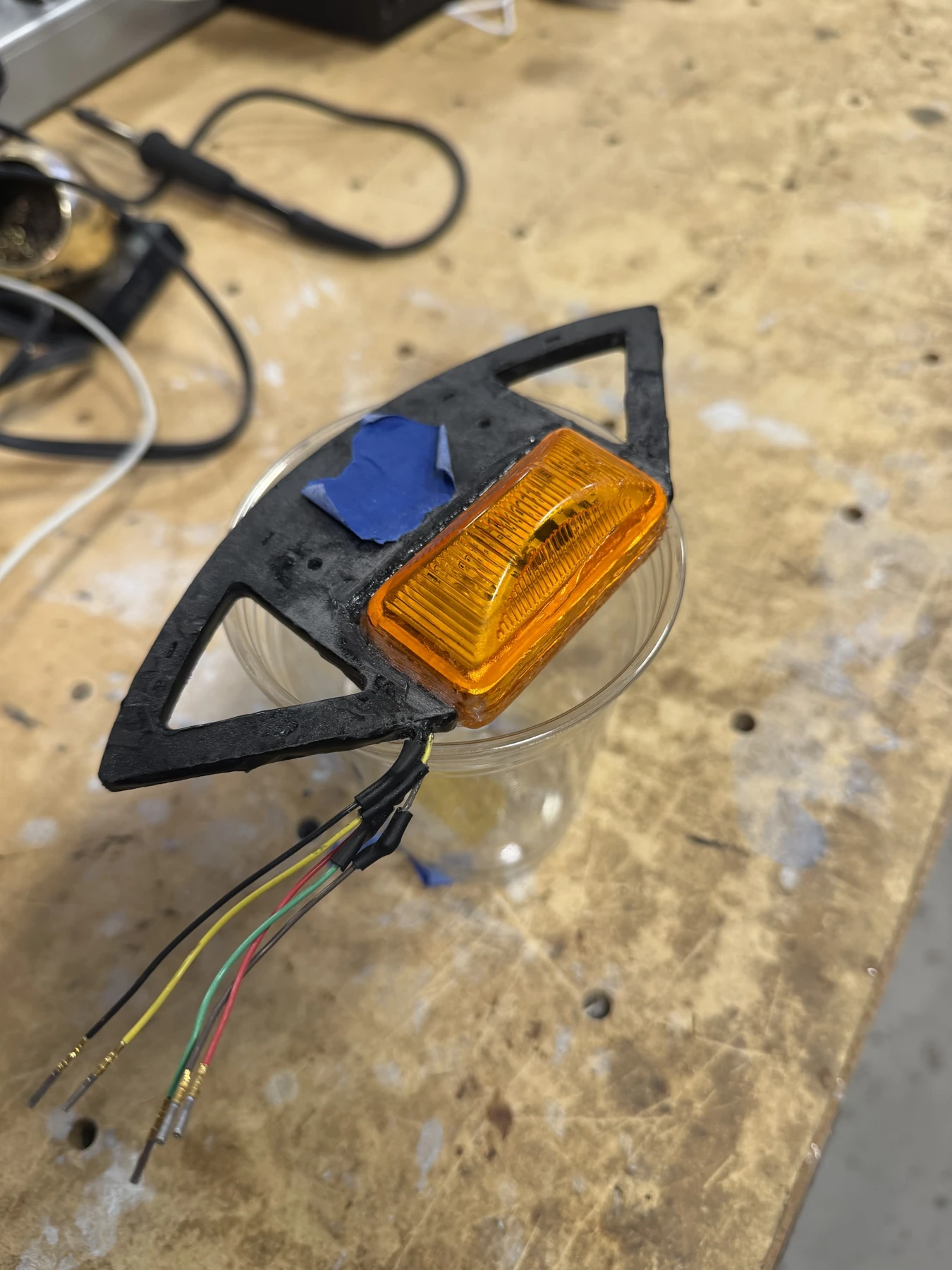 TSSI enclosure and amber lamp on the assembly bench